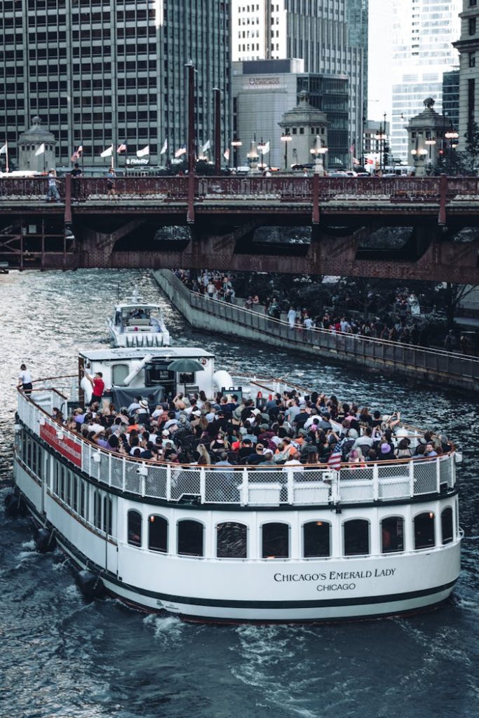 A scenic boat tour navigating Chicago River surrounded by iconic skyscrapers.